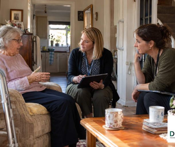 Occupational Therapist and Trusted Assessor discussing equipment and home adaptation needs during a community assessment